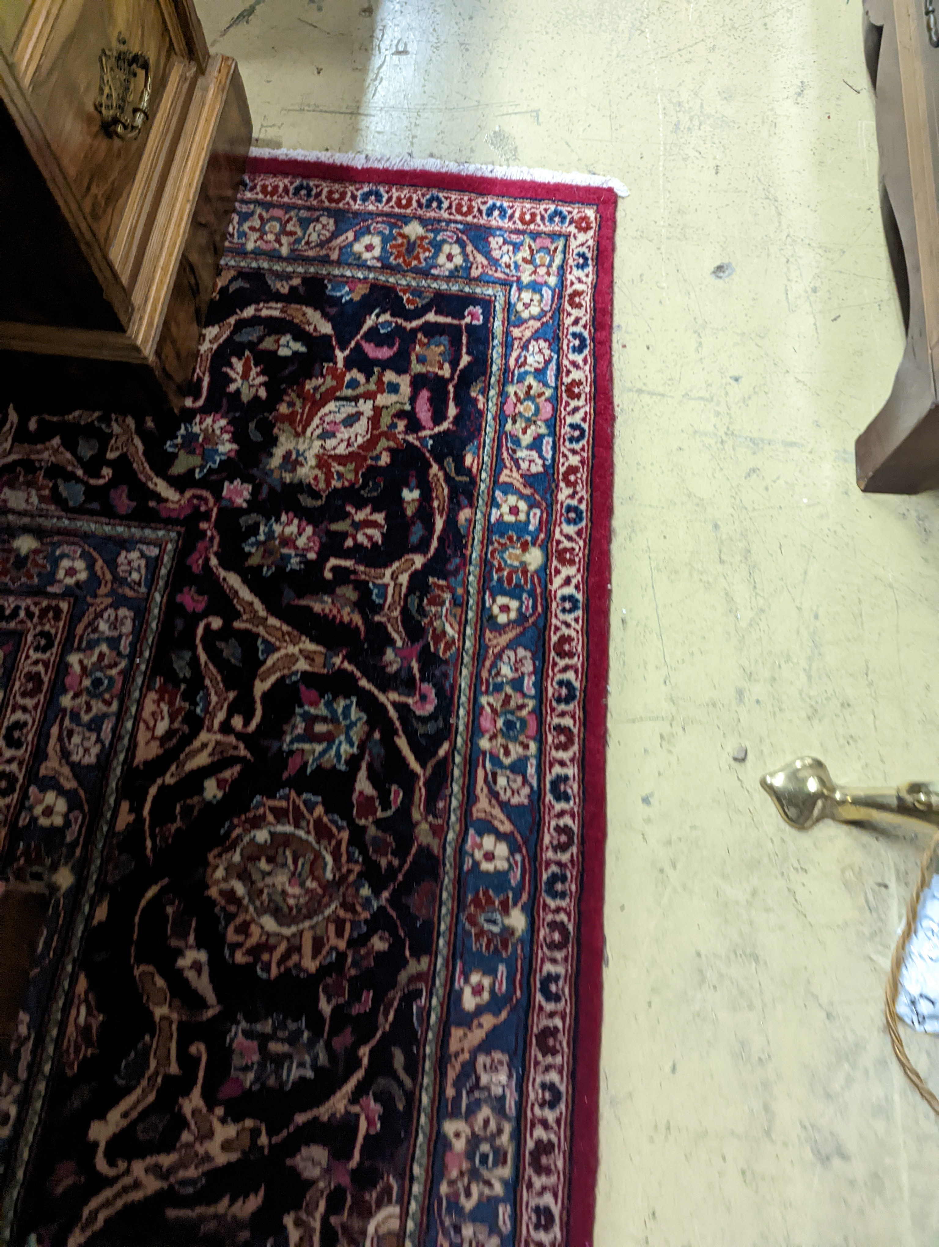 A Kashan burgundy ground carpet, 380 x 300cm